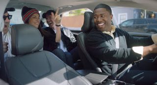 Happy people inside a car