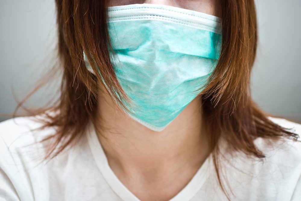 A woman wearing a surgical mask